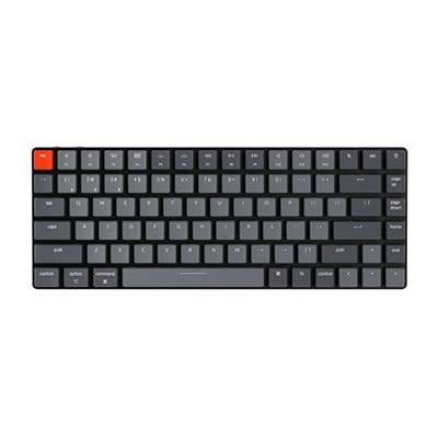 A sleek, modern keyboard with black keys and a distinctive red escape key.